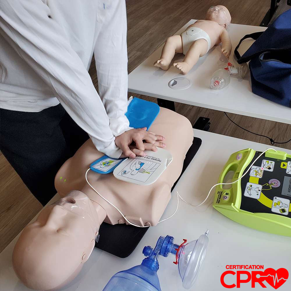 CPR training with mannequin and AED for certification in El Paso.