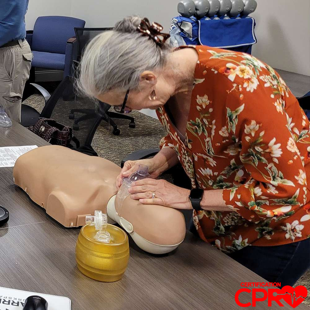 CPR training session with adult mannequin in El Paso.