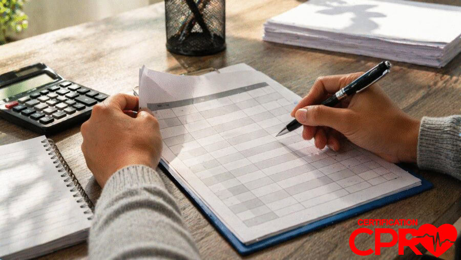 Person filling out a form for CPR certification in El Paso, Texas.